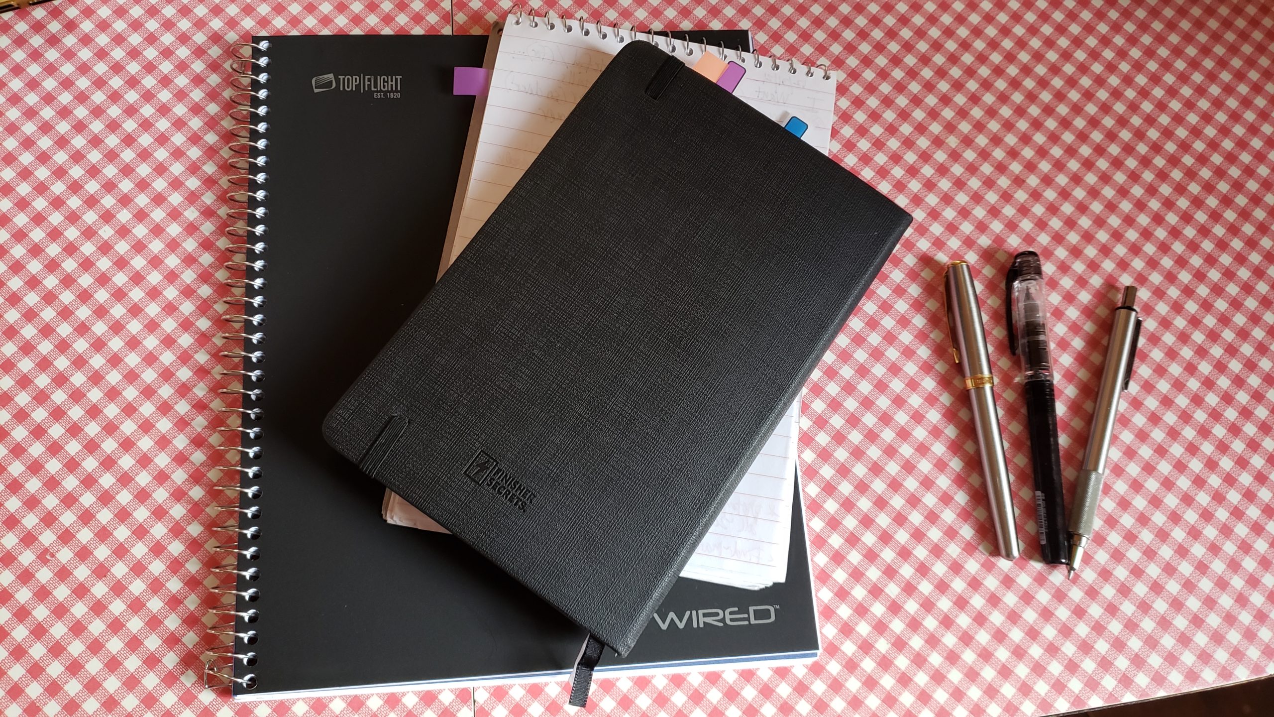 simple black silver white notebooks and pens