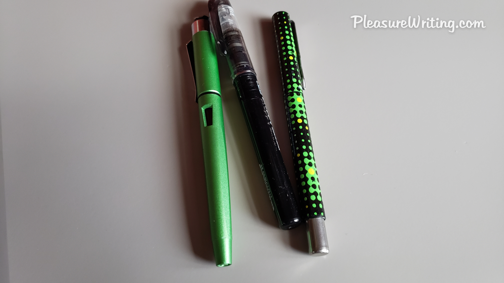 Picture of 3 of P. M. Starr's favorite starter fountain pens in green and black